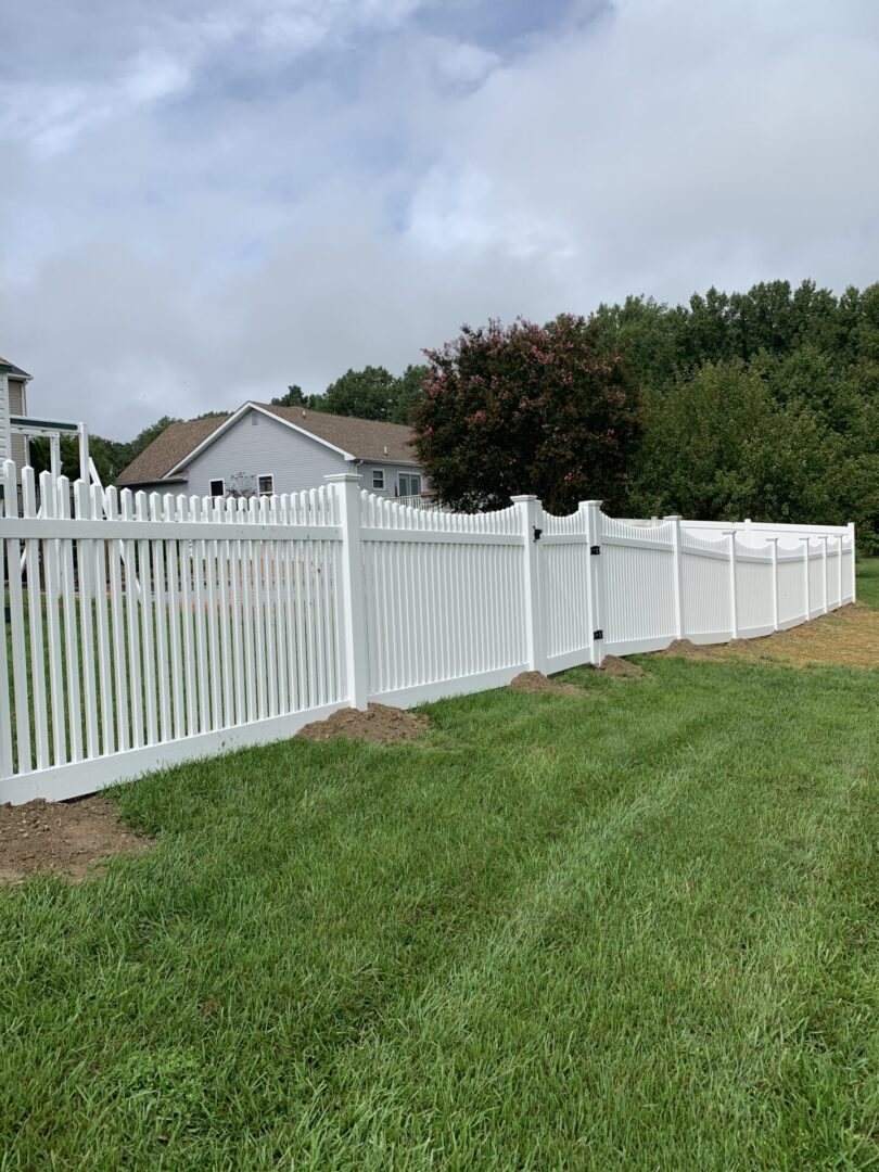 view of the white color fence in the garden